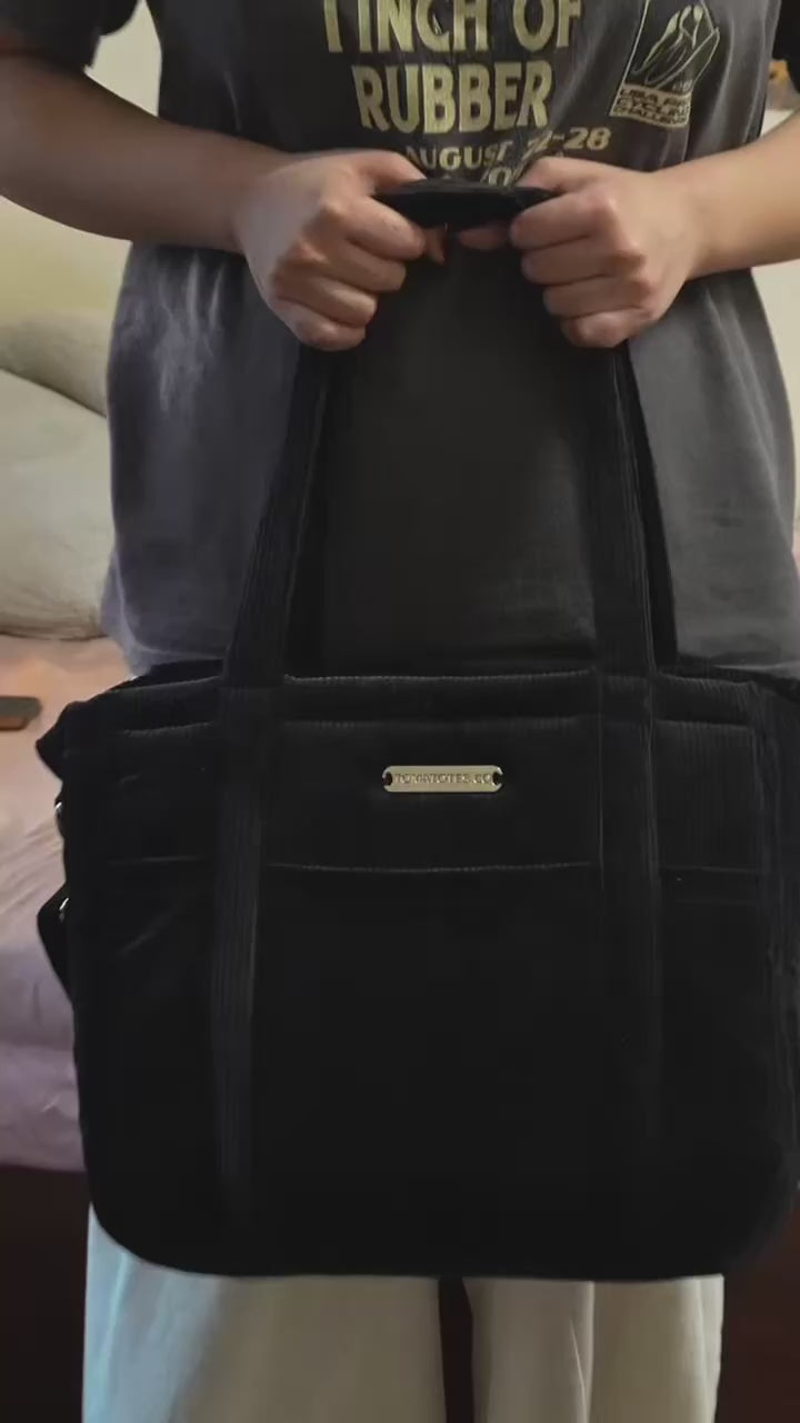 Black organiser bag with a shoulder strap and a crossbody strap video